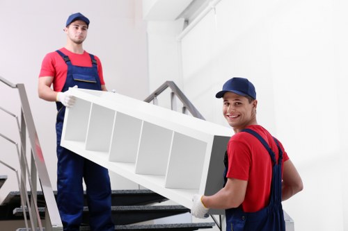 Professional house removal team loading boxes in Romford