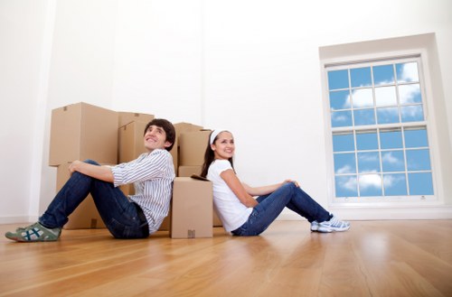 Local moving team assisting with heavy furniture in Romford