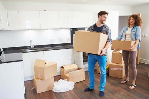 Loading household furniture into a van for a Romford move